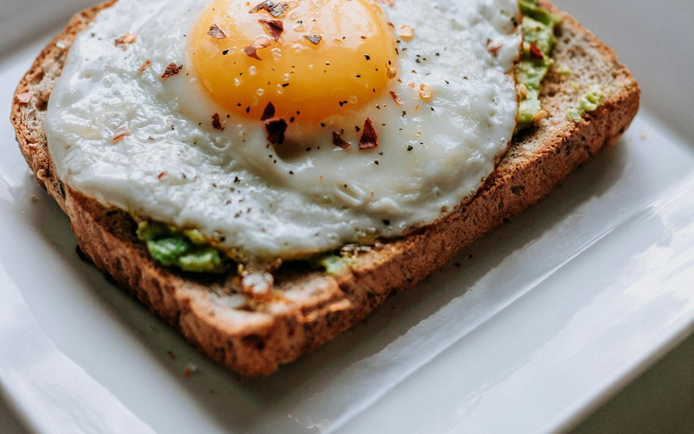 Eggs on toast on a white plate