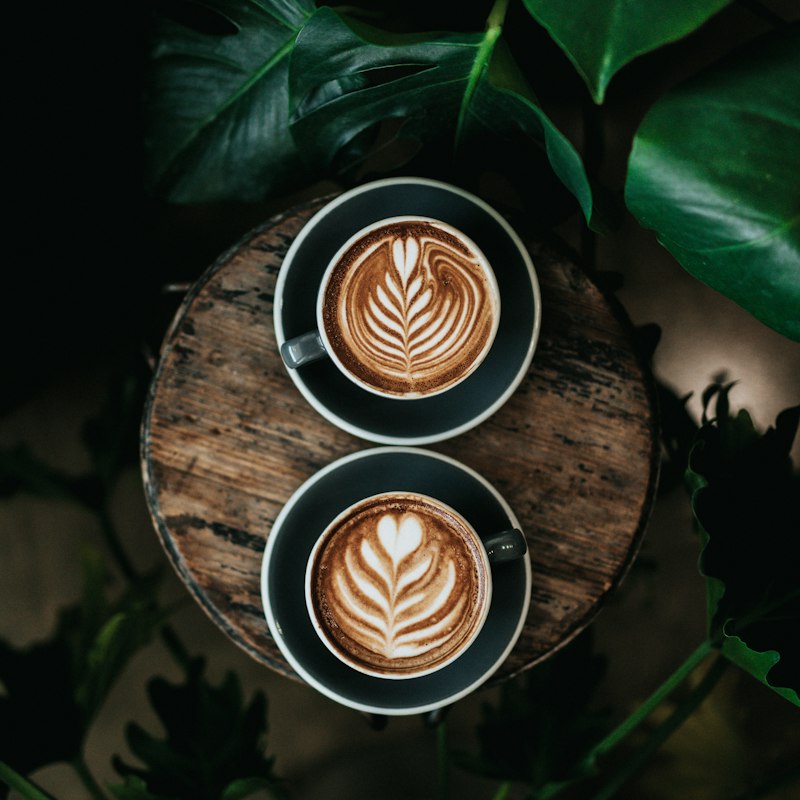 Two green mugs of coffee