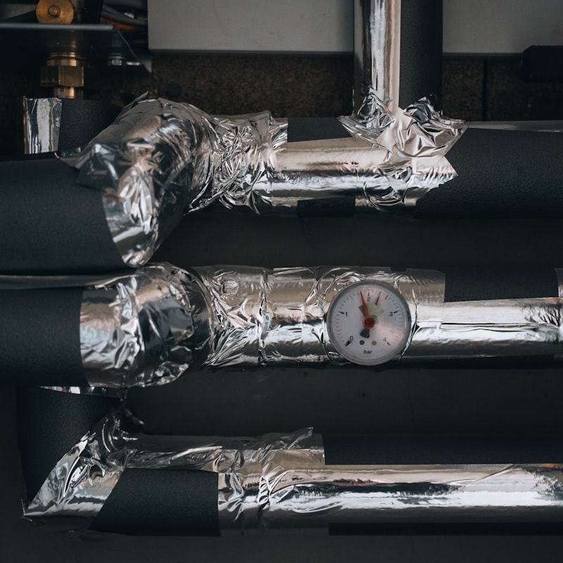 Insulated pipework with a pressure gauge