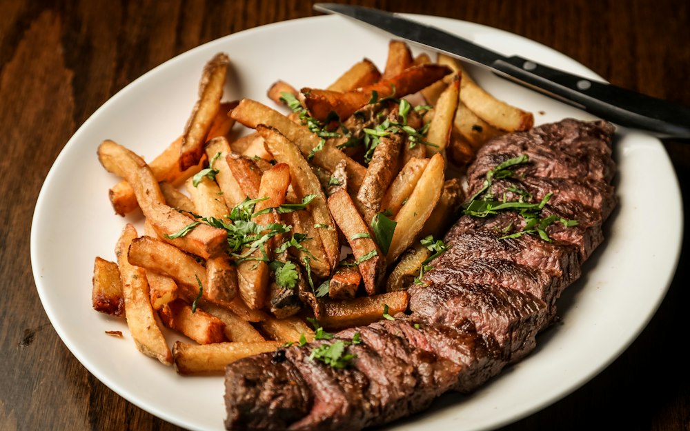 A grilled steak with chips