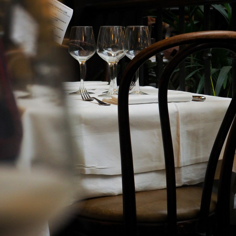 A table laid with glasses and cutlery